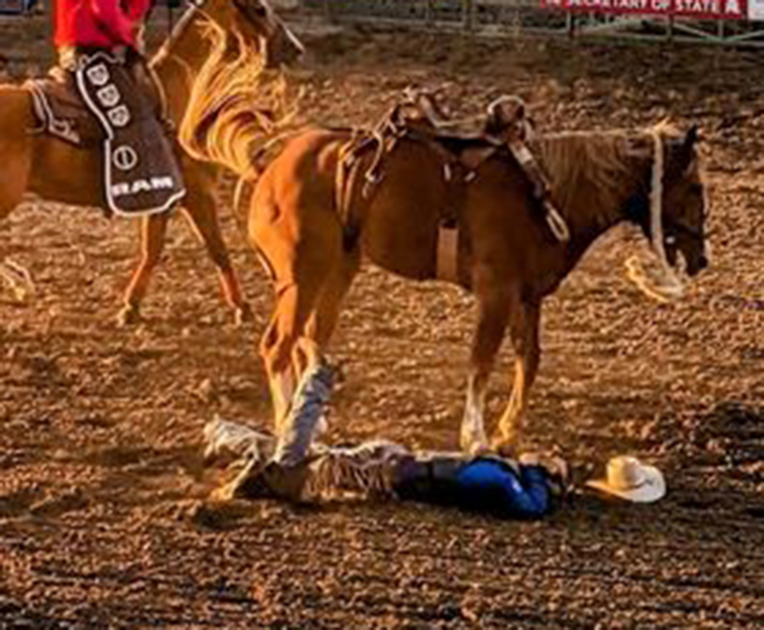 (PHOTOS) Cowboy makes dramatic dismount during Tuesday's rodeo in